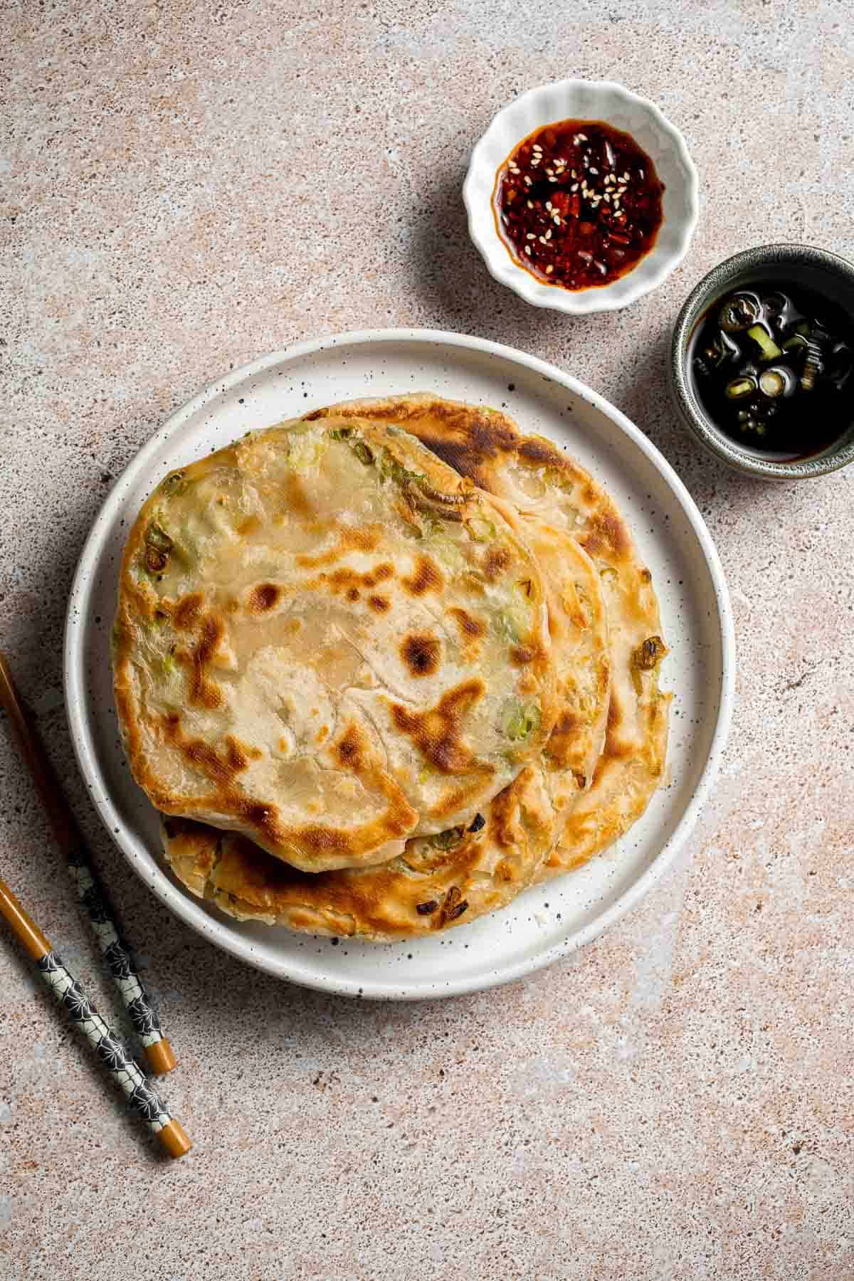 Chinese Scallion Pancakes are crispy, flaky, and packed with savory flavor in every bite. Better than takeout and surprisingly easy to make at home! | aheadofthyme.com