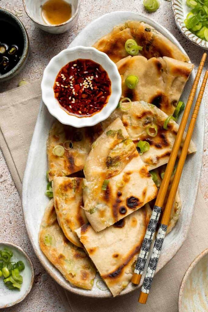 Chinese Scallion Pancakes are crispy, flaky, and packed with savory flavor in every bite. Better than takeout and surprisingly easy to make at home! | aheadofthyme.com