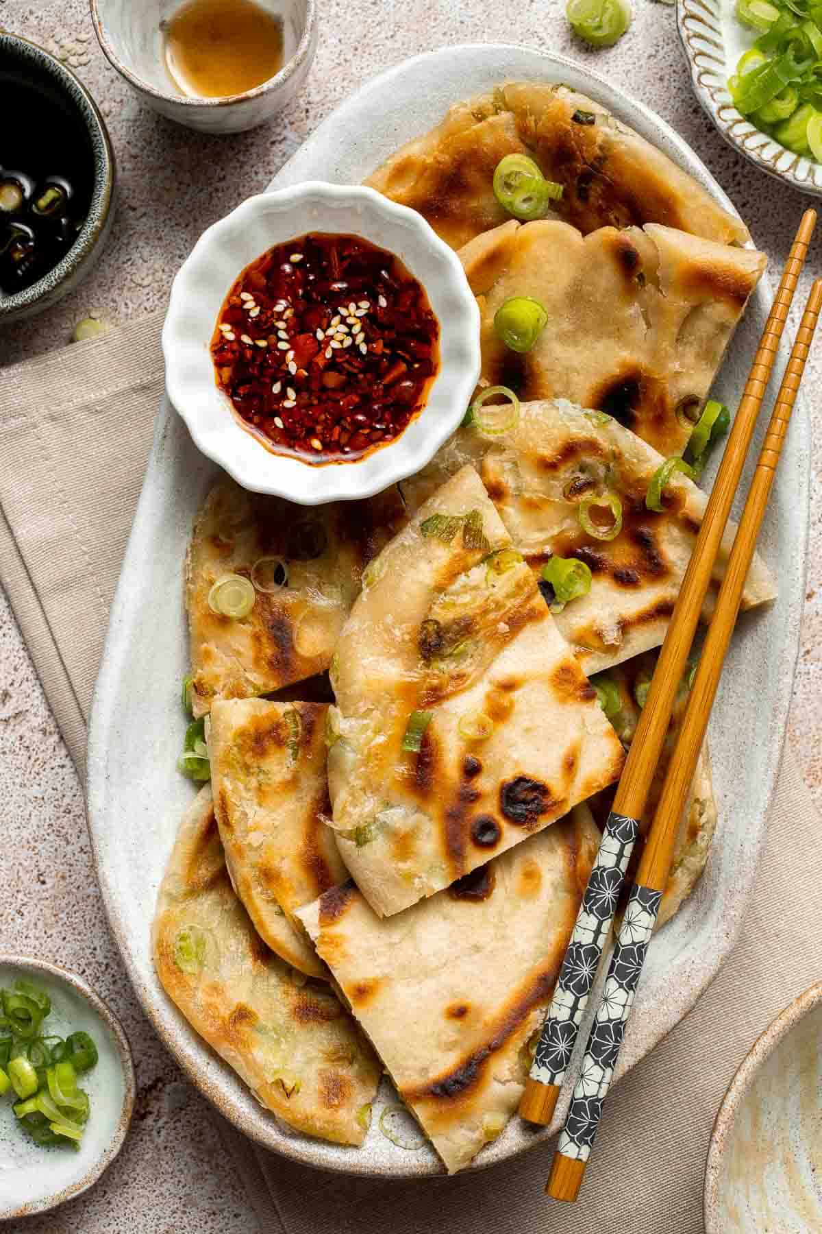 Chinese Scallion Pancakes are crispy, flaky, and packed with savory flavor in every bite. Better than takeout and surprisingly easy to make at home! | aheadofthyme.com