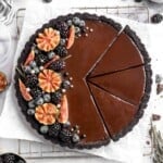 This Chocolate Tart is rich, decadent, and layered with the perfect balance of chocolate ganache and Oreo cookie crust. Way easier to make than you think! | aheadofthyme.com