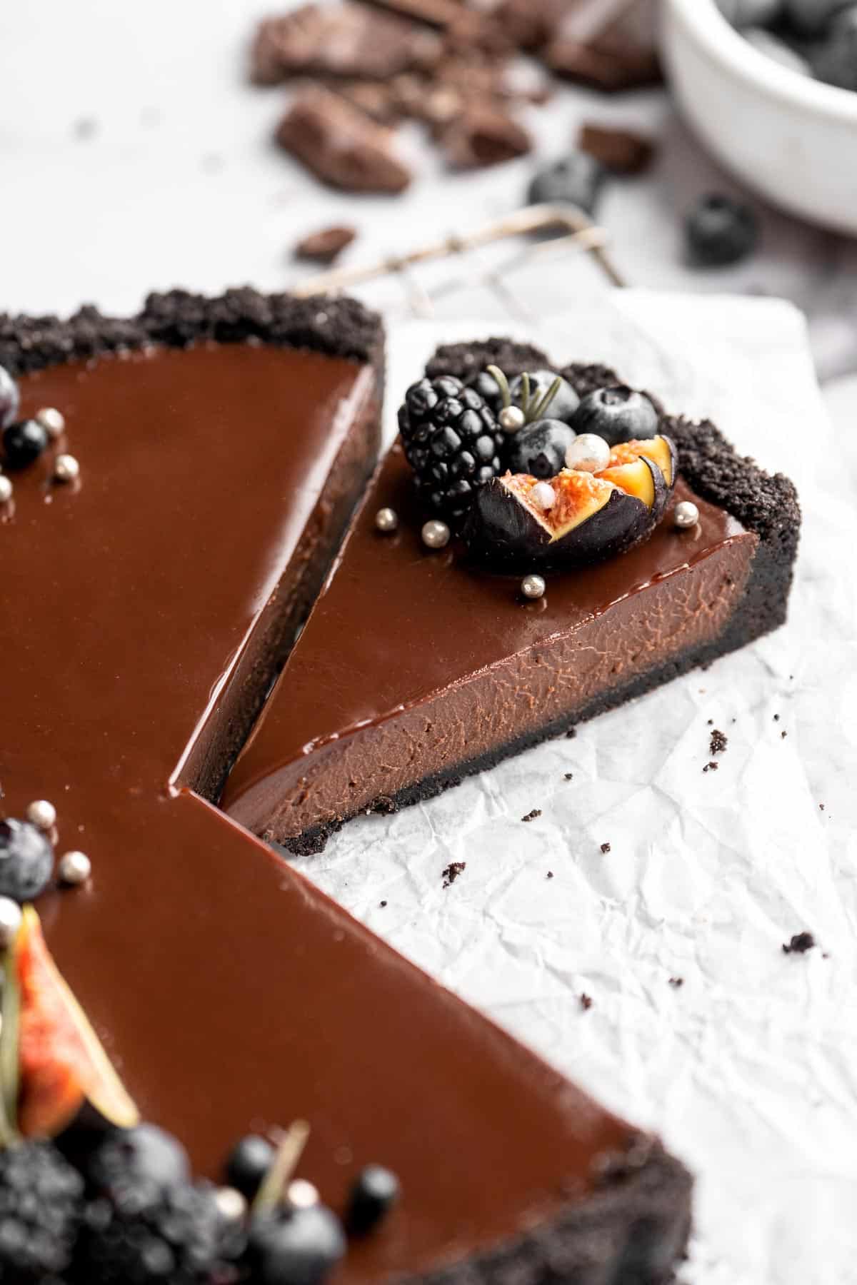 This Chocolate Tart is rich, decadent, and layered with the perfect balance of chocolate ganache and Oreo cookie crust. Way easier to make than you think! | aheadofthyme.com