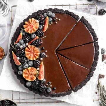 This Chocolate Tart is rich, decadent, and layered with the perfect balance of chocolate ganache and Oreo cookie crust. Way easier to make than you think! | aheadofthyme.com
