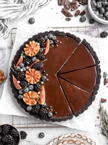 This Chocolate Tart is rich, decadent, and layered with the perfect balance of chocolate ganache and Oreo cookie crust. Way easier to make than you think! | aheadofthyme.com