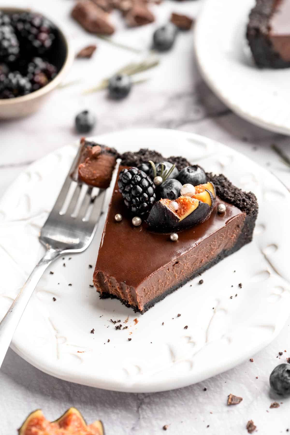 This Chocolate Tart is rich, decadent, and layered with the perfect balance of chocolate ganache and Oreo cookie crust. Way easier to make than you think! | aheadofthyme.com