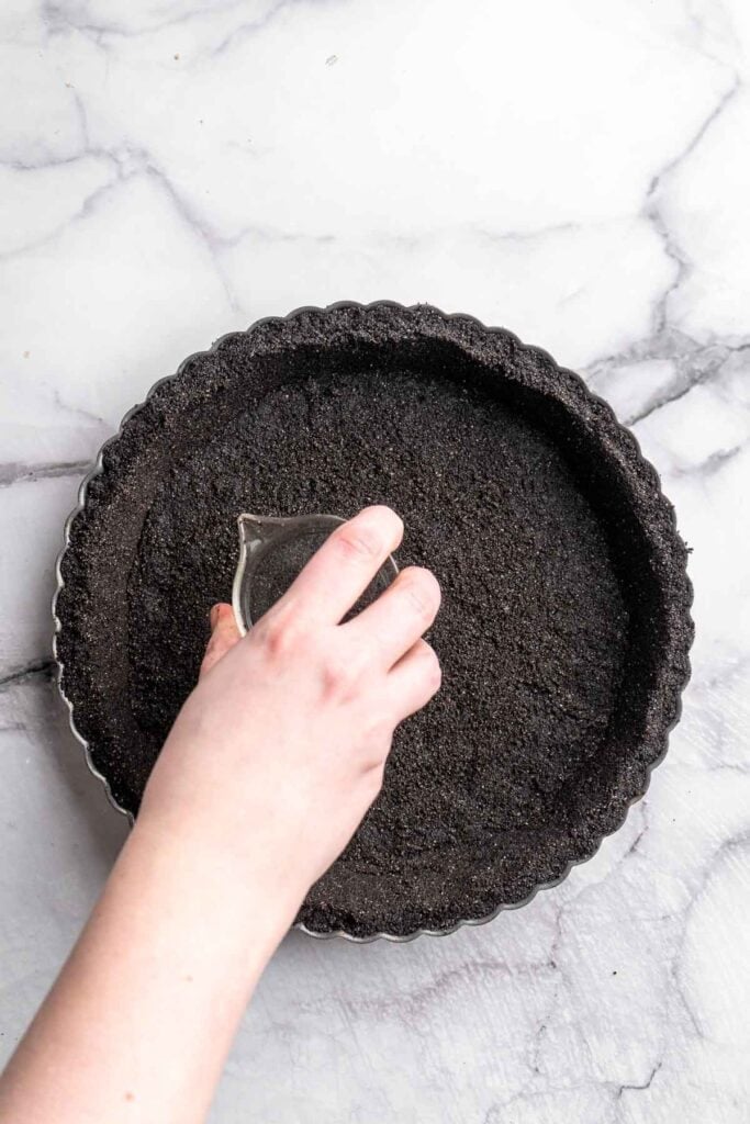 This Chocolate Tart is rich, decadent, and layered with the perfect balance of chocolate ganache and Oreo cookie crust. Way easier to make than you think! | aheadofthyme.com