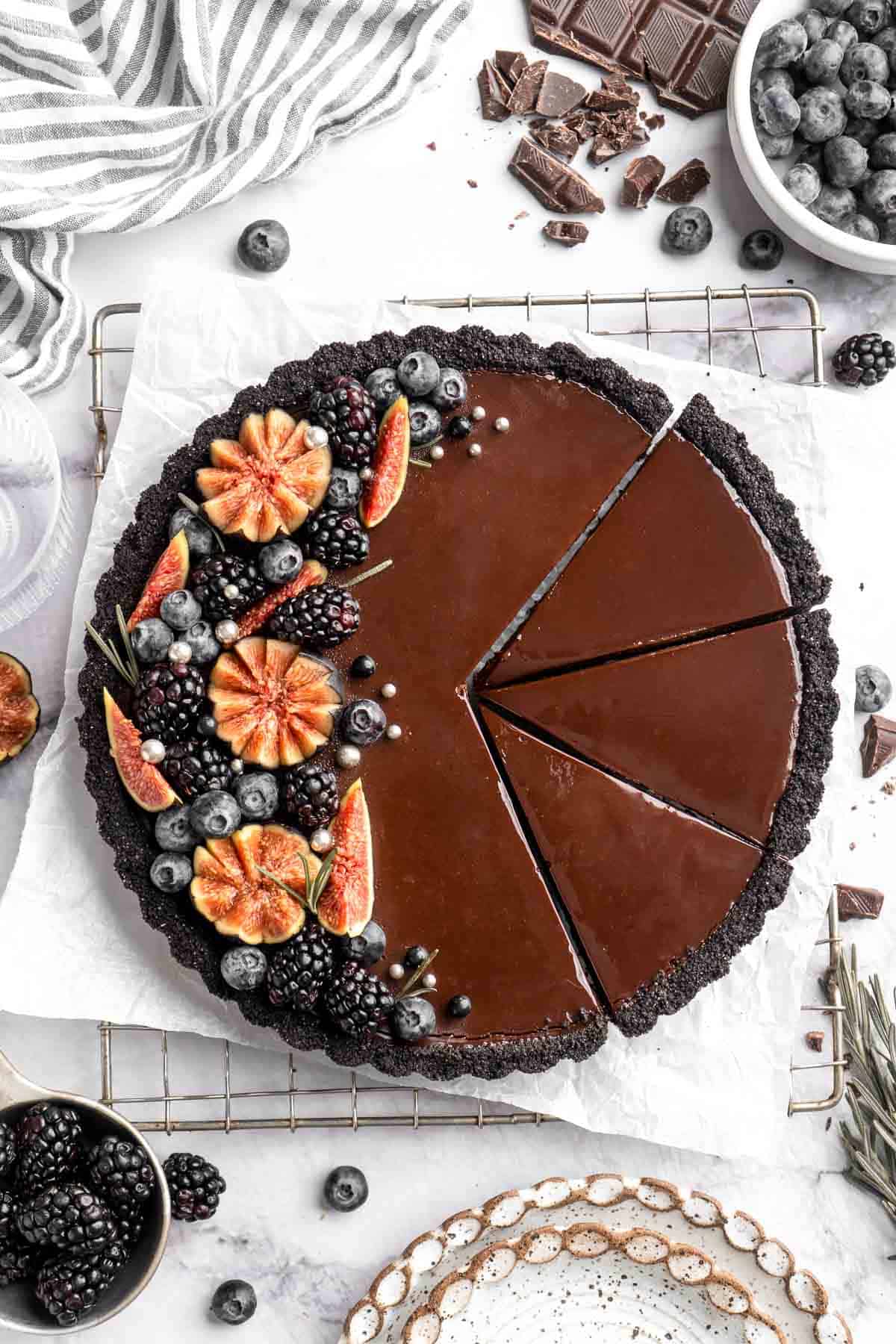 This Chocolate Tart is rich, decadent, and layered with the perfect balance of chocolate ganache and Oreo cookie crust. Way easier to make than you think! | aheadofthyme.com
