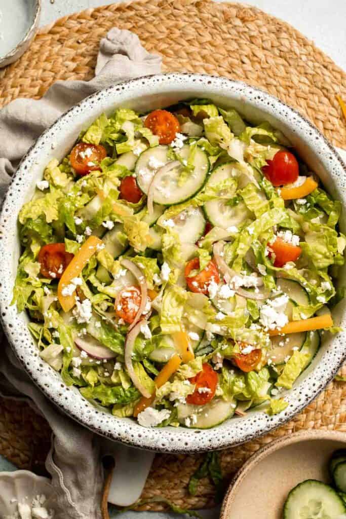Easy Tossed Salad is crisp, colorful, and fresh, made with crunchy romaine lettuce, juicy tomatoes, crisp cucumber, and a simple balsamic vinaigrette. | aheadofthyme.com