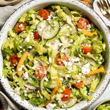 Easy Tossed Salad is crisp, colorful, and fresh, made with crunchy romaine lettuce, juicy tomatoes, crisp cucumber, and a simple balsamic vinaigrette. | aheadofthyme.com