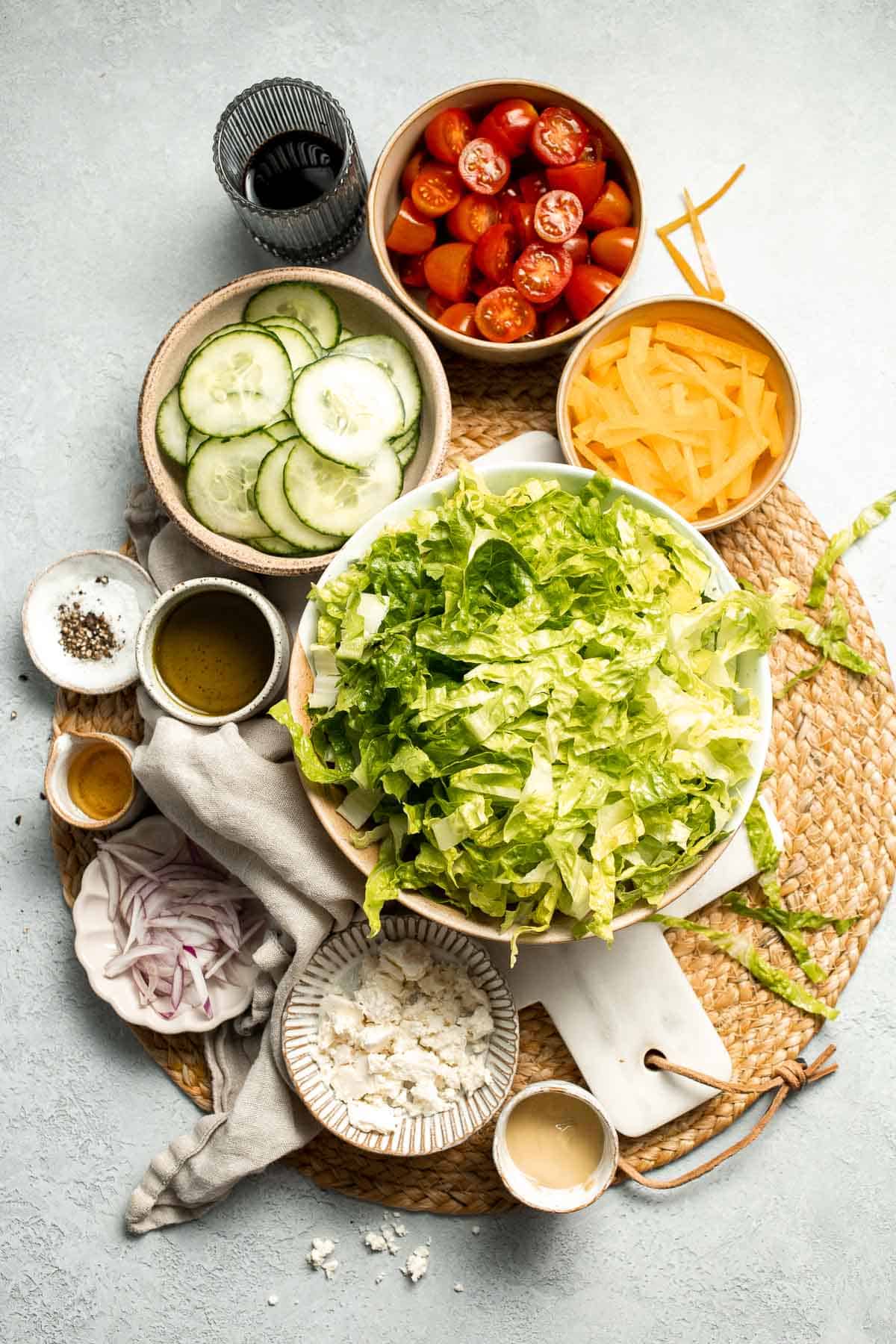 Easy Tossed Salad is crisp, colorful, and fresh, made with crunchy romaine lettuce, juicy tomatoes, crisp cucumber, and a simple balsamic vinaigrette. | aheadofthyme.com
