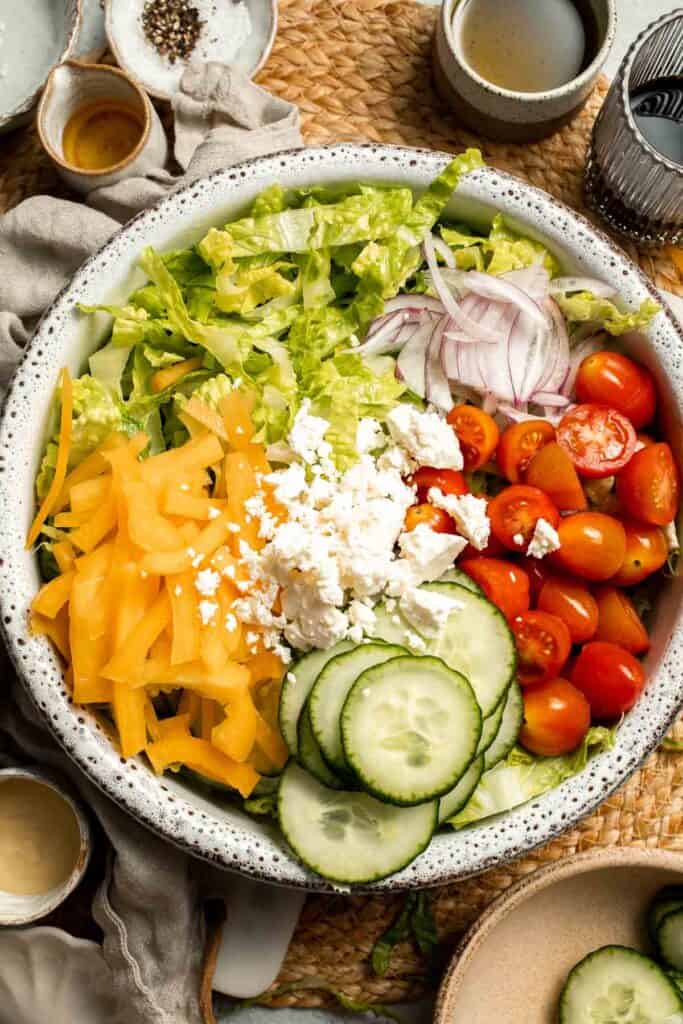 Easy Tossed Salad is crisp, colorful, and fresh, made with crunchy romaine lettuce, juicy tomatoes, crisp cucumber, and a simple balsamic vinaigrette. | aheadofthyme.com