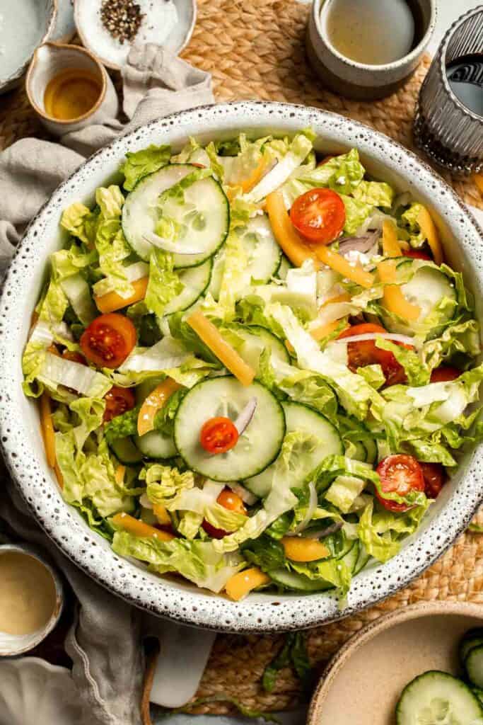Easy Tossed Salad is crisp, colorful, and fresh, made with crunchy romaine lettuce, juicy tomatoes, crisp cucumber, and a simple balsamic vinaigrette. | aheadofthyme.com