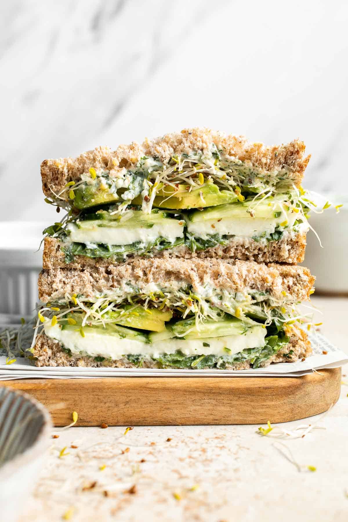 Green Goddess Sandwich is a fresh and vibrant twist on a classic veggie sandwich, packed with a creamy herb sauce, crisp veggies, avocado, and mozzarella. | aheadofthyme.com