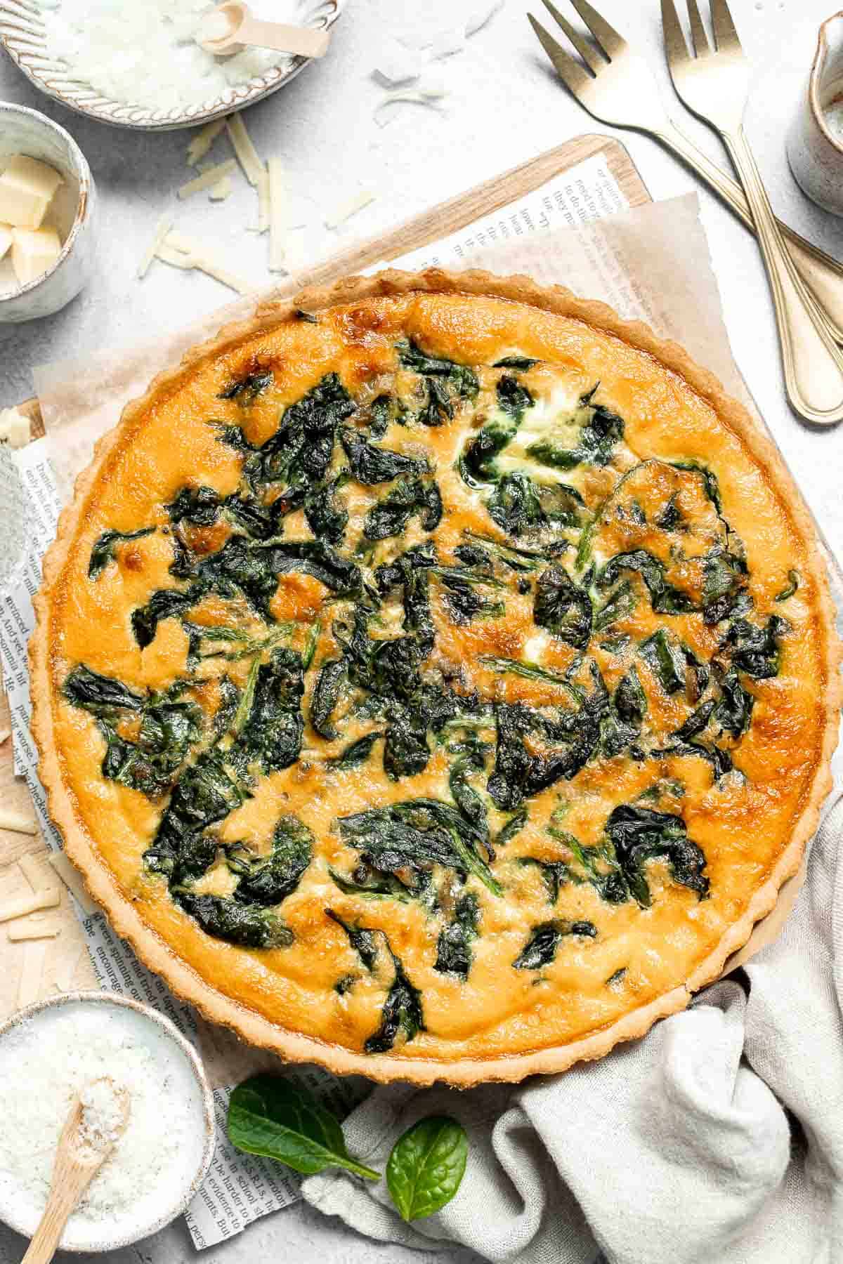 Spinach Quiche is a golden, savory classic with a tender flaky crust and a rich, creamy egg filling that’s packed with flavor. Surprisingly easy to make! | aheadofthyme.com