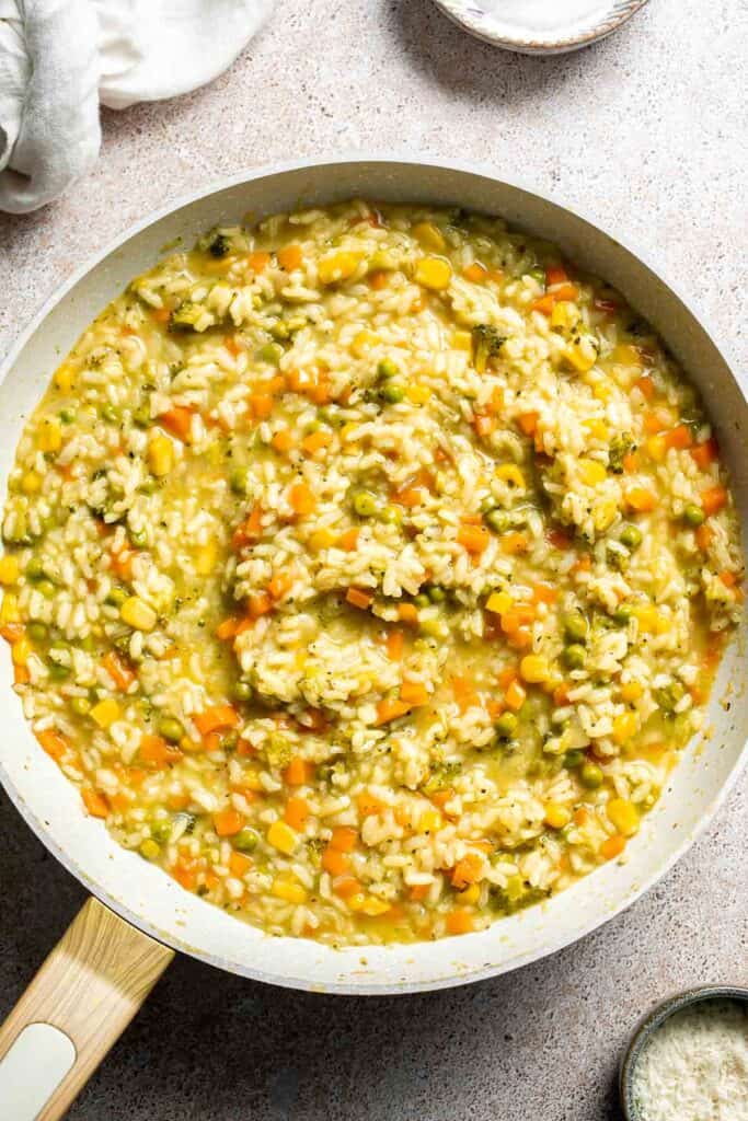 This Vegetable Risotto is rich and creamy, loaded with tender vegetables and arborio rice. It's fancy but totally approachable for weeknight dinner! | aheadofthyme.com