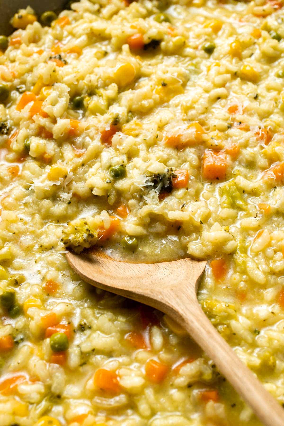 This Vegetable Risotto is rich and creamy, loaded with tender vegetables and arborio rice. It's fancy but totally approachable for weeknight dinner! | aheadofthyme.com