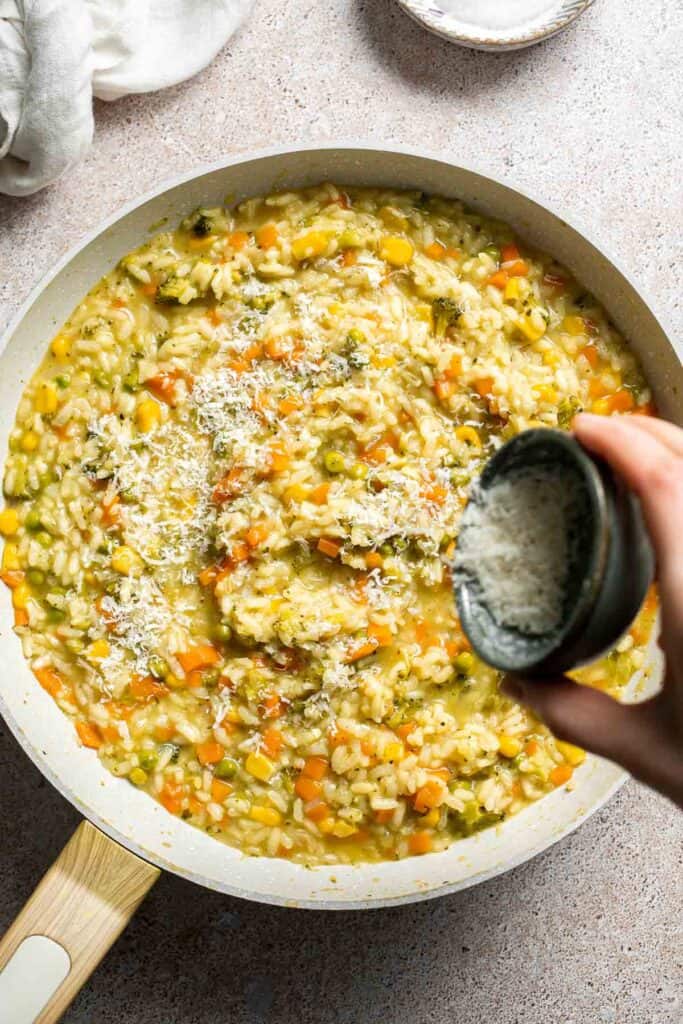 This Vegetable Risotto is rich and creamy, loaded with tender vegetables and arborio rice. It's fancy but totally approachable for weeknight dinner! | aheadofthyme.com