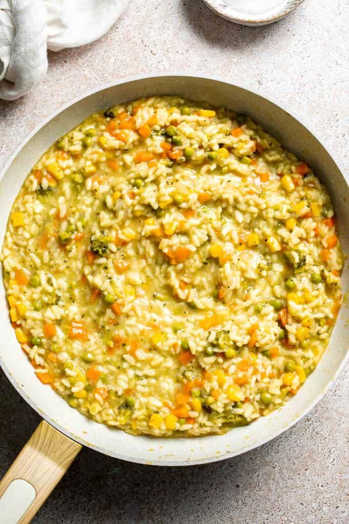 This Vegetable Risotto is rich and creamy, loaded with tender vegetables and arborio rice. It's fancy but totally approachable for weeknight dinner! | aheadofthyme.com