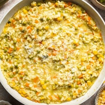 This Vegetable Risotto is rich and creamy, loaded with tender vegetables and arborio rice. It's fancy but totally approachable for weeknight dinner! | aheadofthyme.com