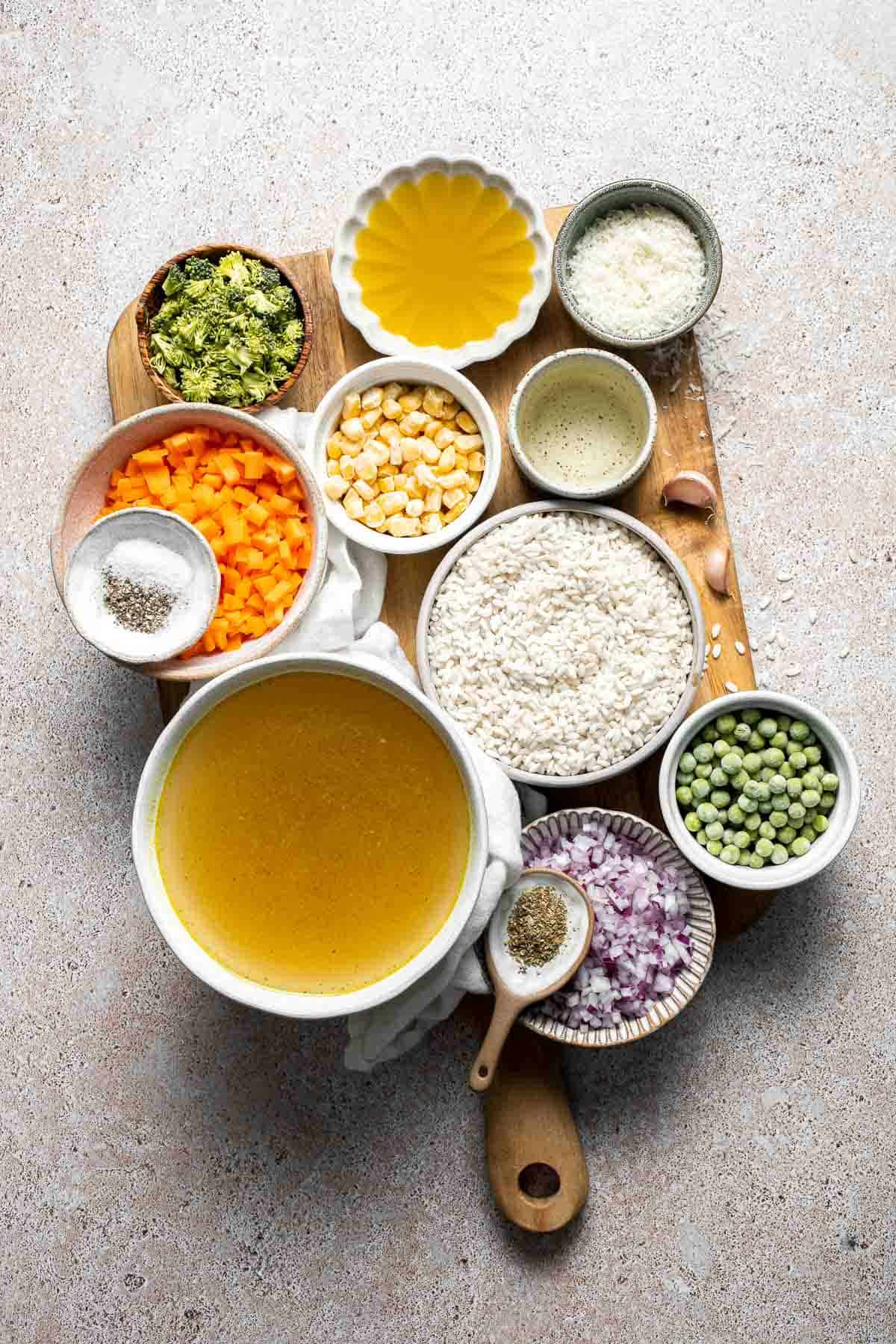 This Vegetable Risotto is rich and creamy, loaded with tender vegetables and arborio rice. It's fancy but totally approachable for weeknight dinner! | aheadofthyme.com