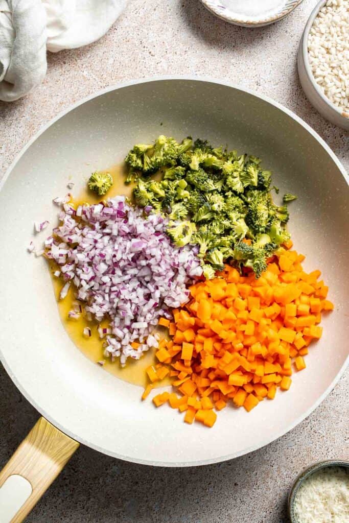 This Vegetable Risotto is rich and creamy, loaded with tender vegetables and arborio rice. It's fancy but totally approachable for weeknight dinner! | aheadofthyme.com