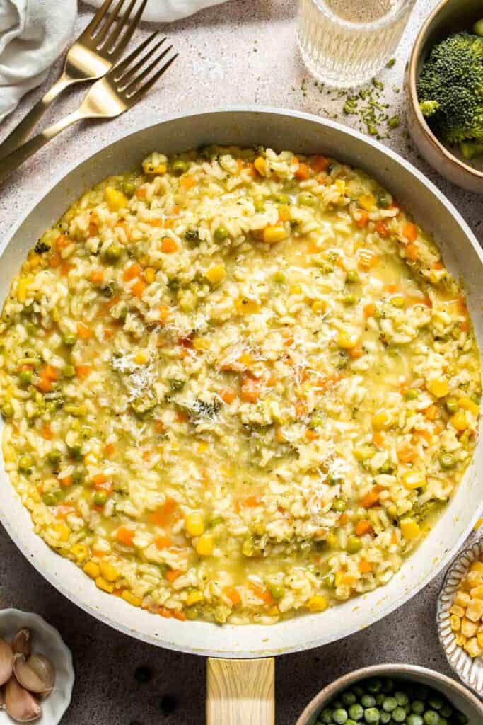 This Vegetable Risotto is rich and creamy, loaded with tender vegetables and arborio rice. It's fancy but totally approachable for weeknight dinner! | aheadofthyme.com