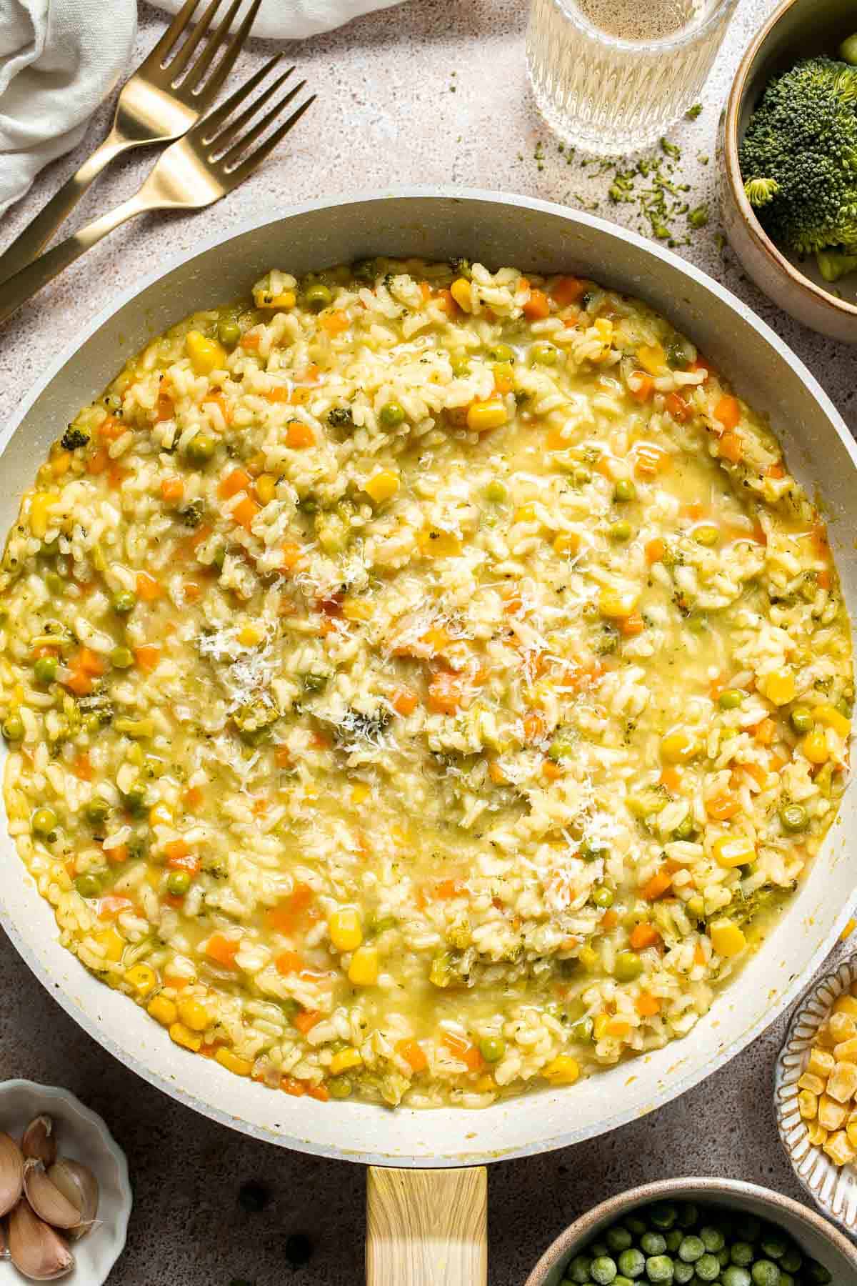 This Vegetable Risotto is rich and creamy, loaded with tender vegetables and arborio rice. It's fancy but totally approachable for weeknight dinner! | aheadofthyme.com
