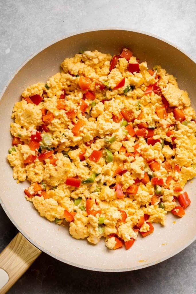Vegetarian Breakfast Burritos are packed with crispy potatoes, veggies, fluffy eggs, cheese, and avocado. A balanced breakfast that actually keeps you full! | aheadofthyme.com