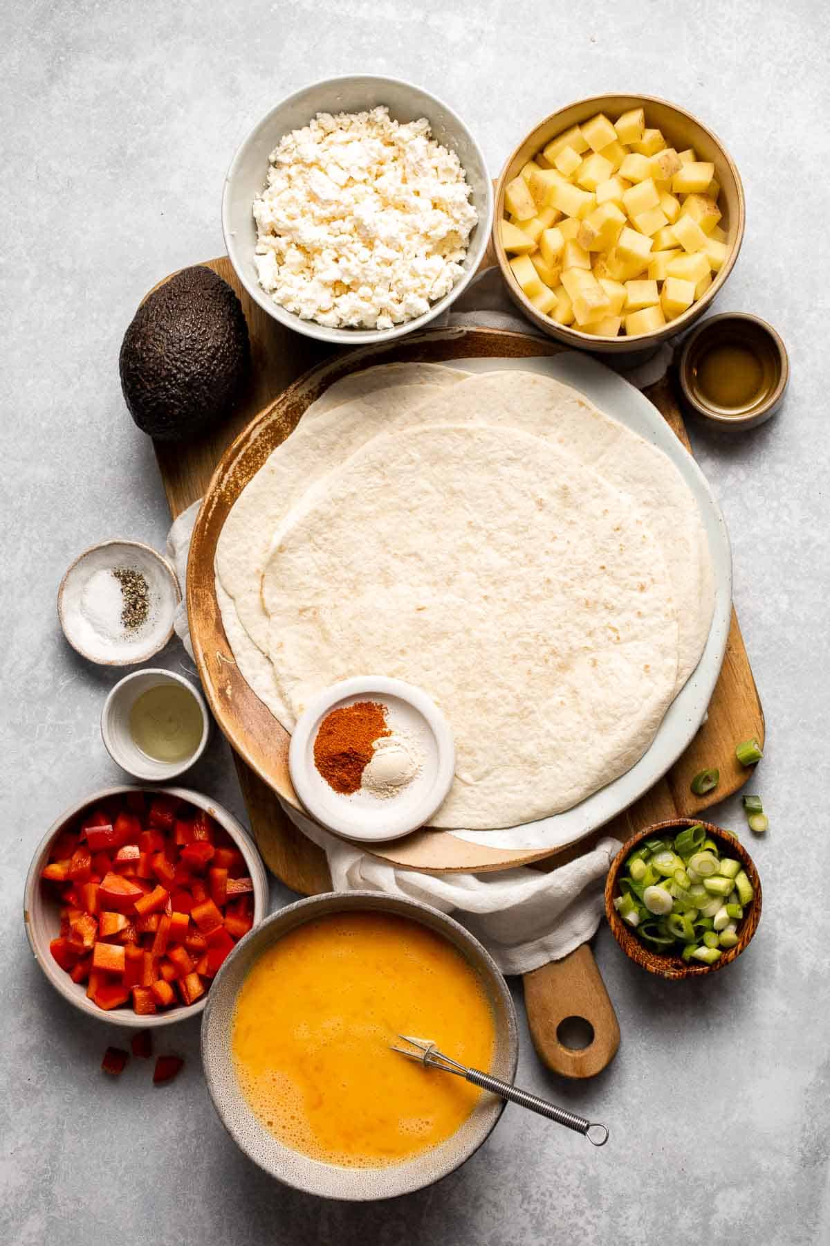 Vegetarian Breakfast Burritos are packed with crispy potatoes, veggies, fluffy eggs, cheese, and avocado. A balanced breakfast that actually keeps you full! | aheadofthyme.com