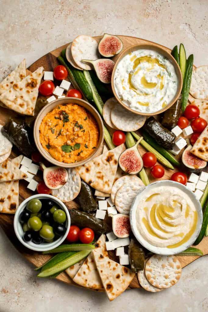This easy Mezze Platter brings the best of Mediterranean snacking straight to your table with a colorful mix of dips, crisp vegetables, and briny bites. | aheadofthyme.com