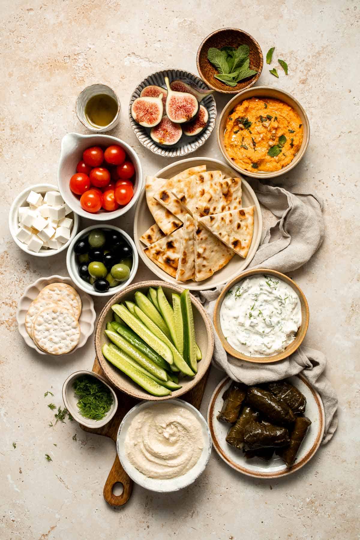 This easy Mezze Platter brings the best of Mediterranean snacking straight to your table with a colorful mix of dips, crisp vegetables, and briny bites. | aheadofthyme.com