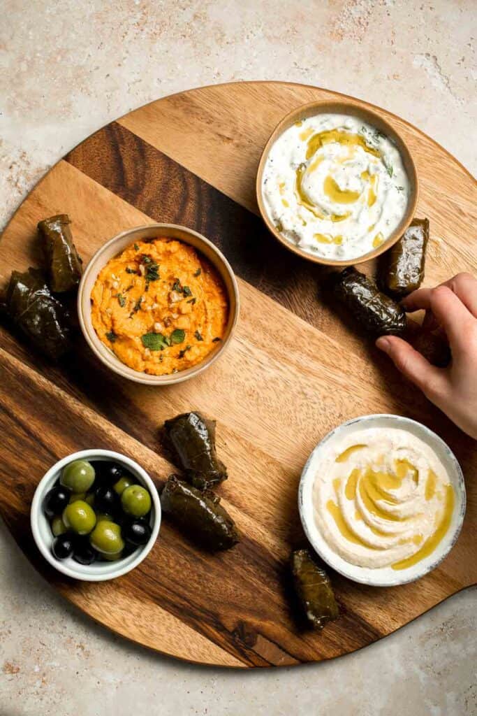 This easy Mezze Platter brings the best of Mediterranean snacking straight to your table with a colorful mix of dips, crisp vegetables, and briny bites. | aheadofthyme.com
