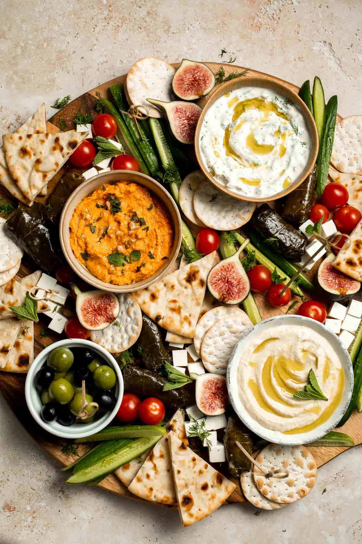 This easy Mezze Platter brings the best of Mediterranean snacking straight to your table with a colorful mix of dips, crisp vegetables, and briny bites. | aheadofthyme.com