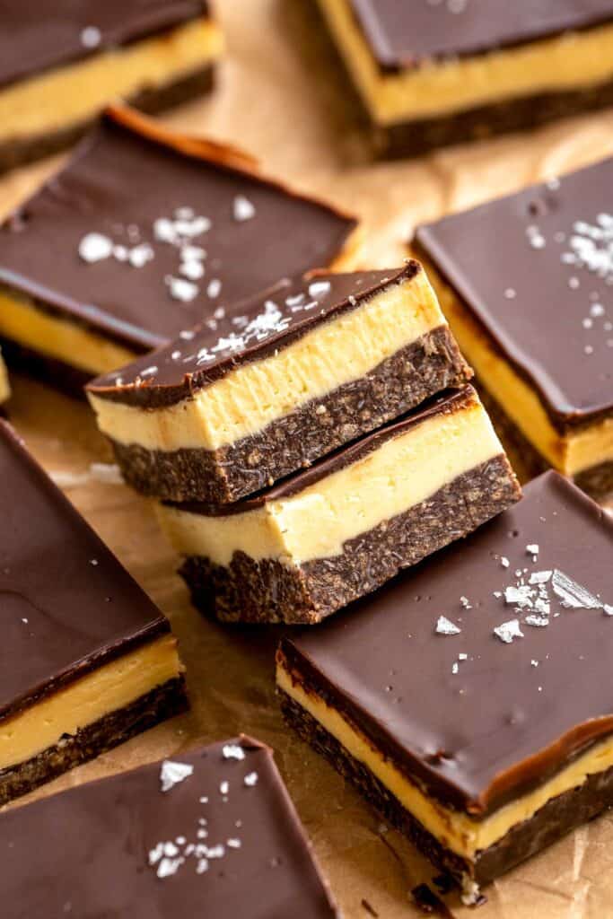 Classic Nanaimo Bars are a rich, no-bake Canadian dessert featuring three layers: chocolate-coconut graham base, custard center, and chocolate topping. | aheadofthyme.com