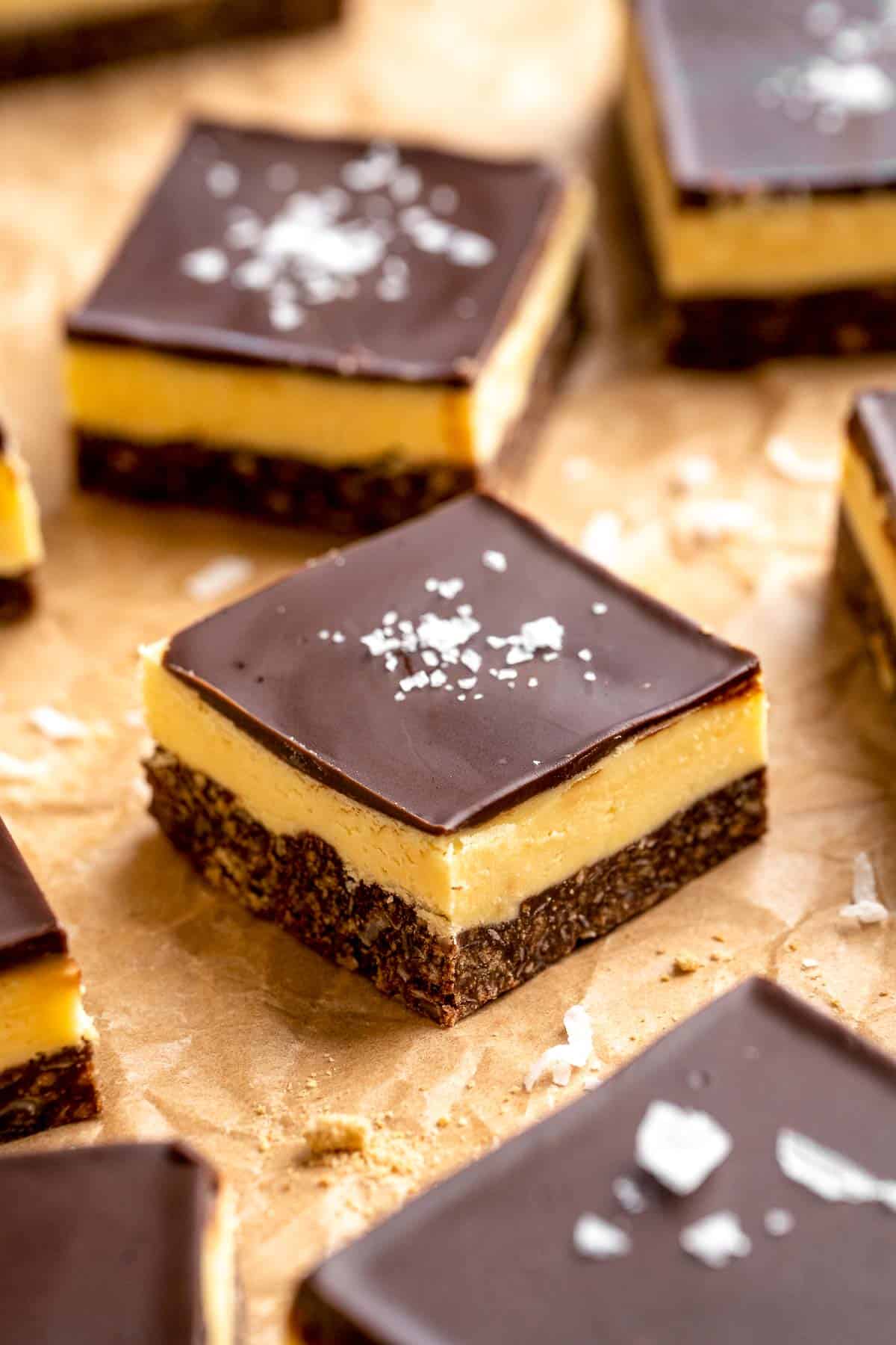 Classic Nanaimo Bars are a rich, no-bake Canadian dessert featuring three layers: chocolate-coconut graham base, custard center, and chocolate topping. | aheadofthyme.com