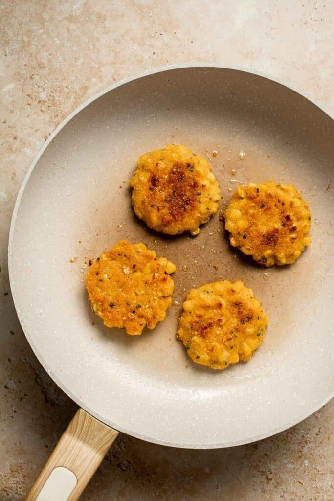 Crispy Corn Fritters are golden, savory, and quick to make. Perfect as a snack, appetizer, or side with your favorite summer meals! | aheadofthyme.com