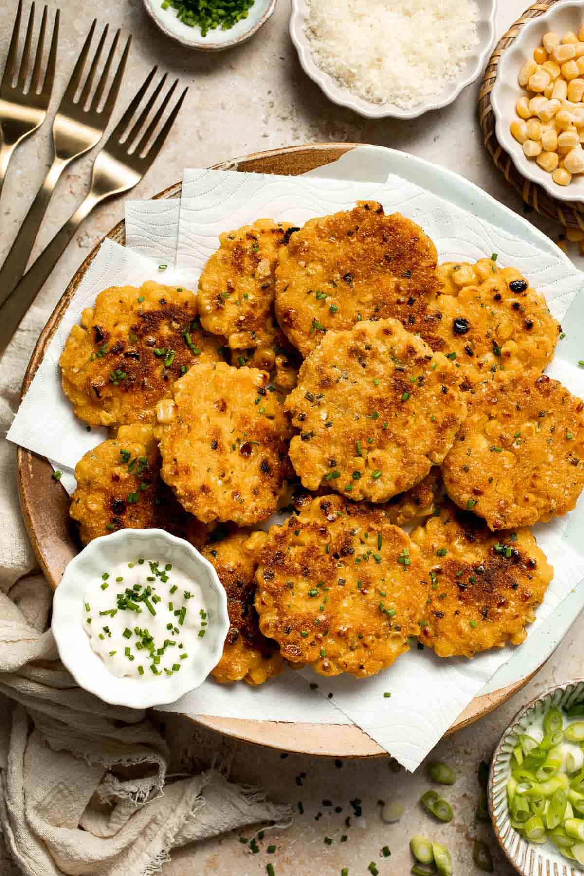 Crispy Corn Fritters are golden, savory, and quick to make. Perfect as a snack, appetizer, or side with your favorite summer meals! | aheadofthyme.com