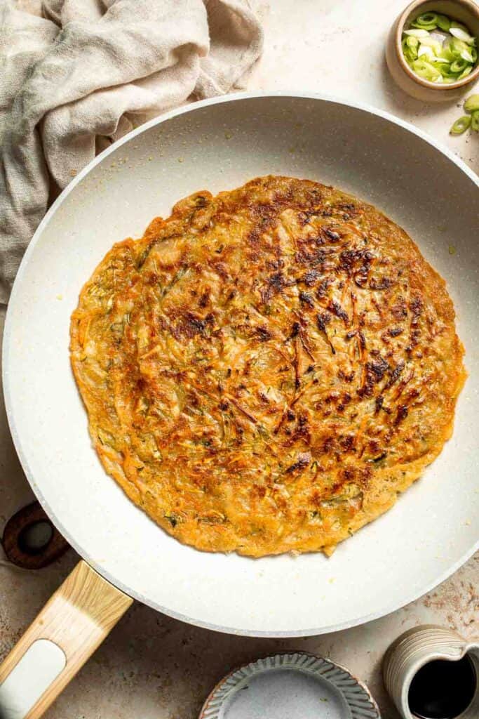 Crispy Korean Vegetable Pancakes (Yachaejeon) are quick, golden, and packed with colorful veggies. Serve with dipping sauce for a delicious snack or meal. | aheadofthyme.com