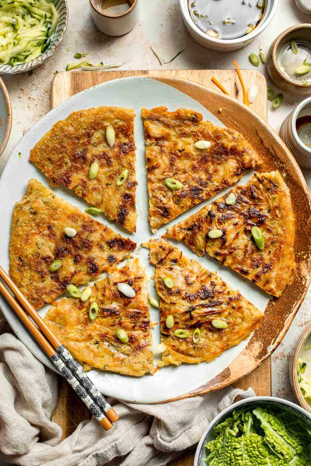 Crispy Korean Vegetable Pancakes (Yachaejeon) are quick, golden, and packed with colorful veggies. Serve with dipping sauce for a delicious snack or meal. | aheadofthyme.com