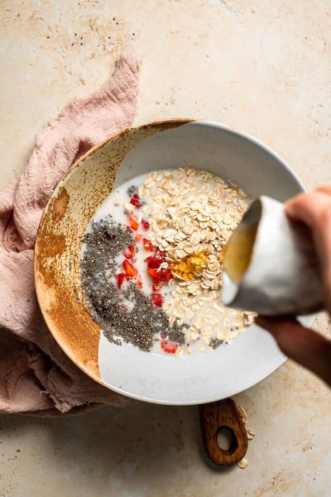Strawberry Overnight Oats are a healthy, make-ahead breakfast with rolled oats, Greek yogurt, and fresh strawberries. Perfect for busy mornings! | aheadofthyme.com