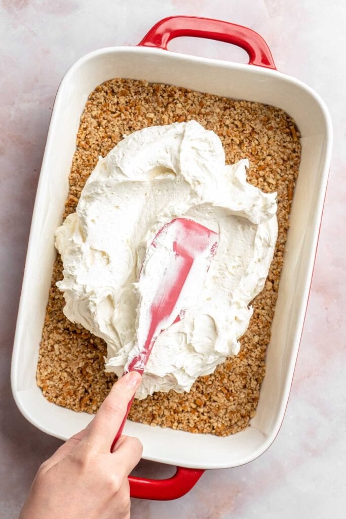 This Strawberry Pretzel Salad features a buttery pretzel crust, creamy filling, and fruity Jello topping — perfect for summer parties and potlucks! | aheadofthyme.com
