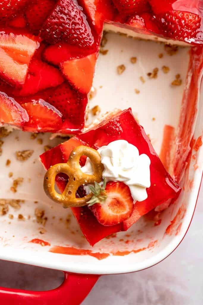 This Strawberry Pretzel Salad features a buttery pretzel crust, creamy filling, and fruity Jello topping — perfect for summer parties and potlucks! | aheadofthyme.com