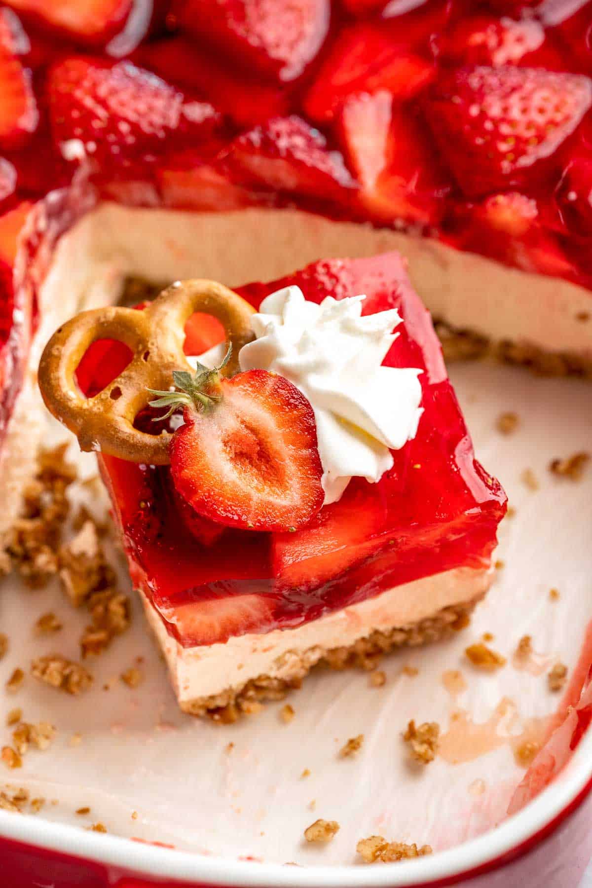 This Strawberry Pretzel Salad features a buttery pretzel crust, creamy filling, and fruity Jello topping — perfect for summer parties and potlucks! | aheadofthyme.com