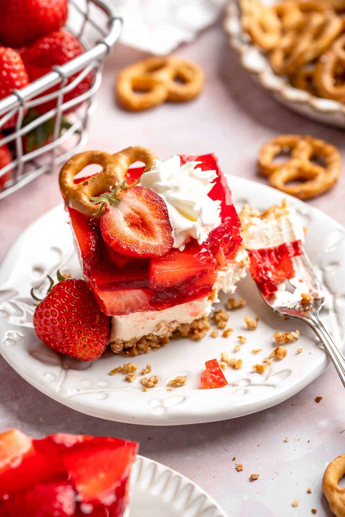 This Strawberry Pretzel Salad features a buttery pretzel crust, creamy filling, and fruity Jello topping — perfect for summer parties and potlucks! | aheadofthyme.com