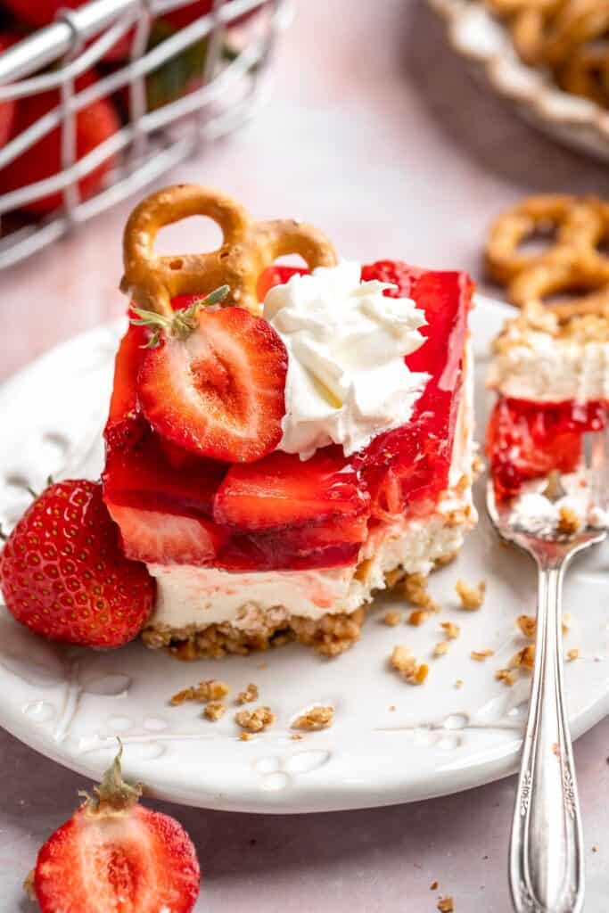 This Strawberry Pretzel Salad features a buttery pretzel crust, creamy filling, and fruity Jello topping — perfect for summer parties and potlucks! | aheadofthyme.com