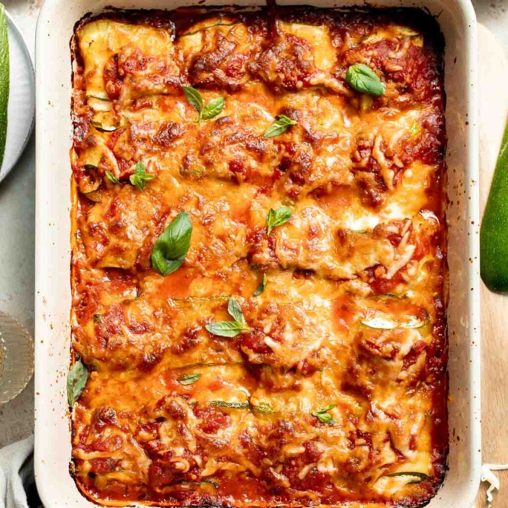 Baked Zucchini Roll Ups are a low carb lasagna alternative with ricotta, marinara, and cheese rolled in tender zucchini slices. It's healthier and lighter! | aheadofthyme.com