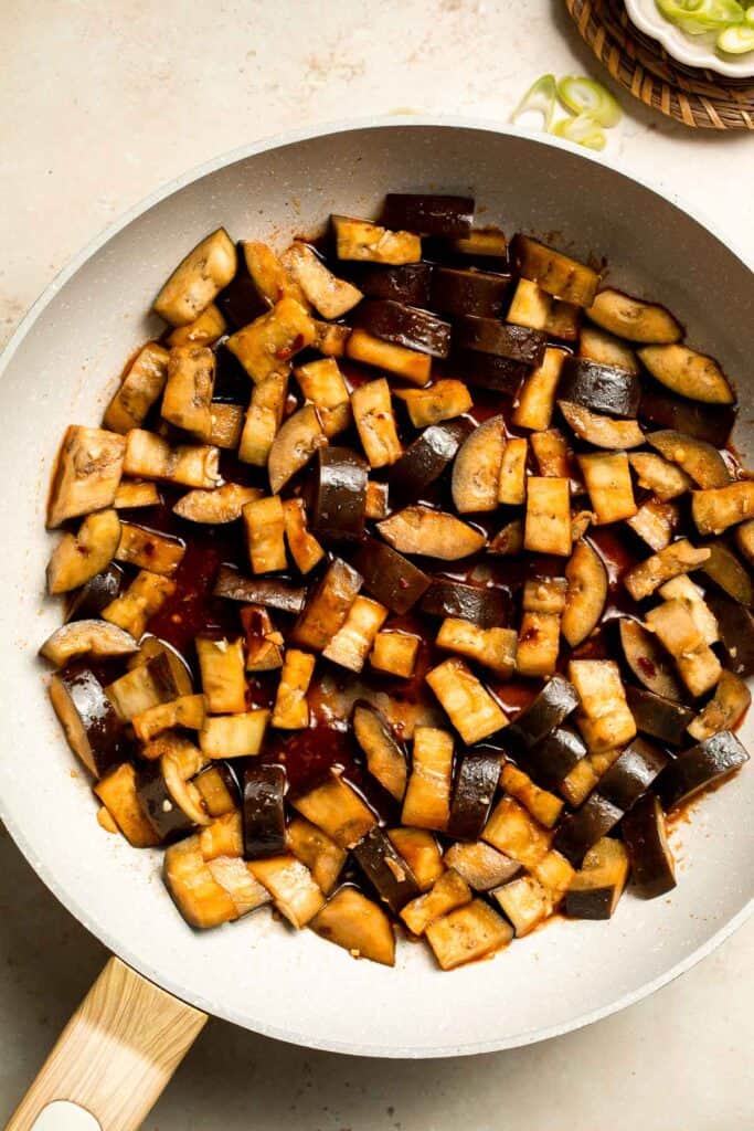 Quick and flavorful, this Chinese Eggplant Stir Fry is packed with garlic, ginger, and savory sauce. Perfect for rice or noodles! | aheadofthyme.com