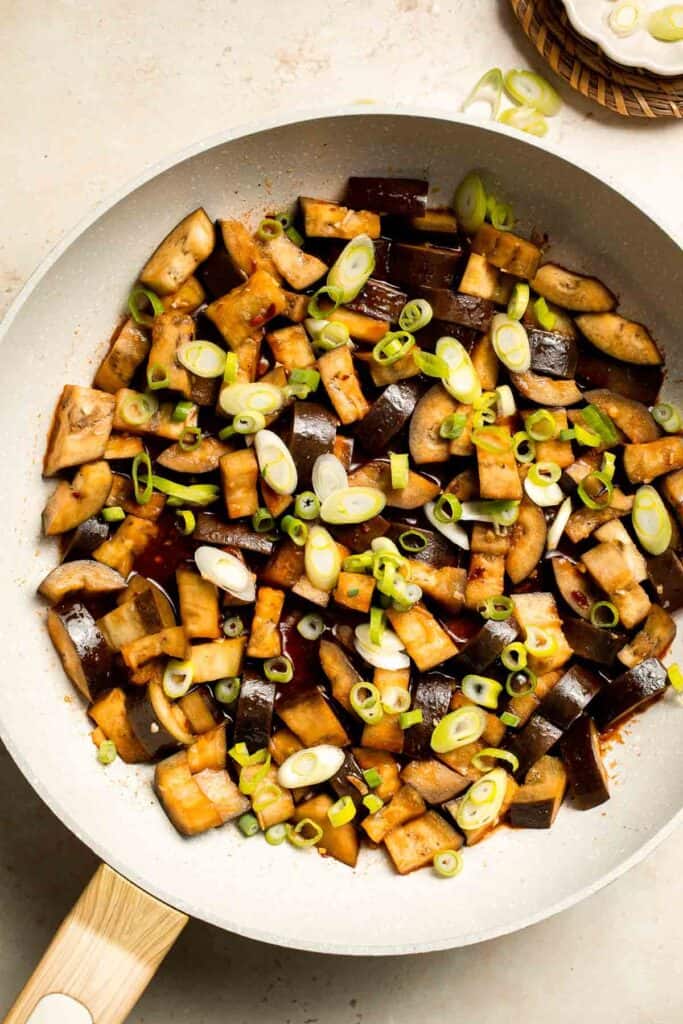 Quick and flavorful, this Chinese Eggplant Stir Fry is packed with garlic, ginger, and savory sauce. Perfect for rice or noodles! | aheadofthyme.com