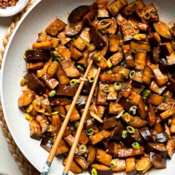 Quick and flavorful, this Chinese Eggplant Stir Fry is packed with garlic, ginger, and savory sauce. Perfect for rice or noodles! | aheadofthyme.com