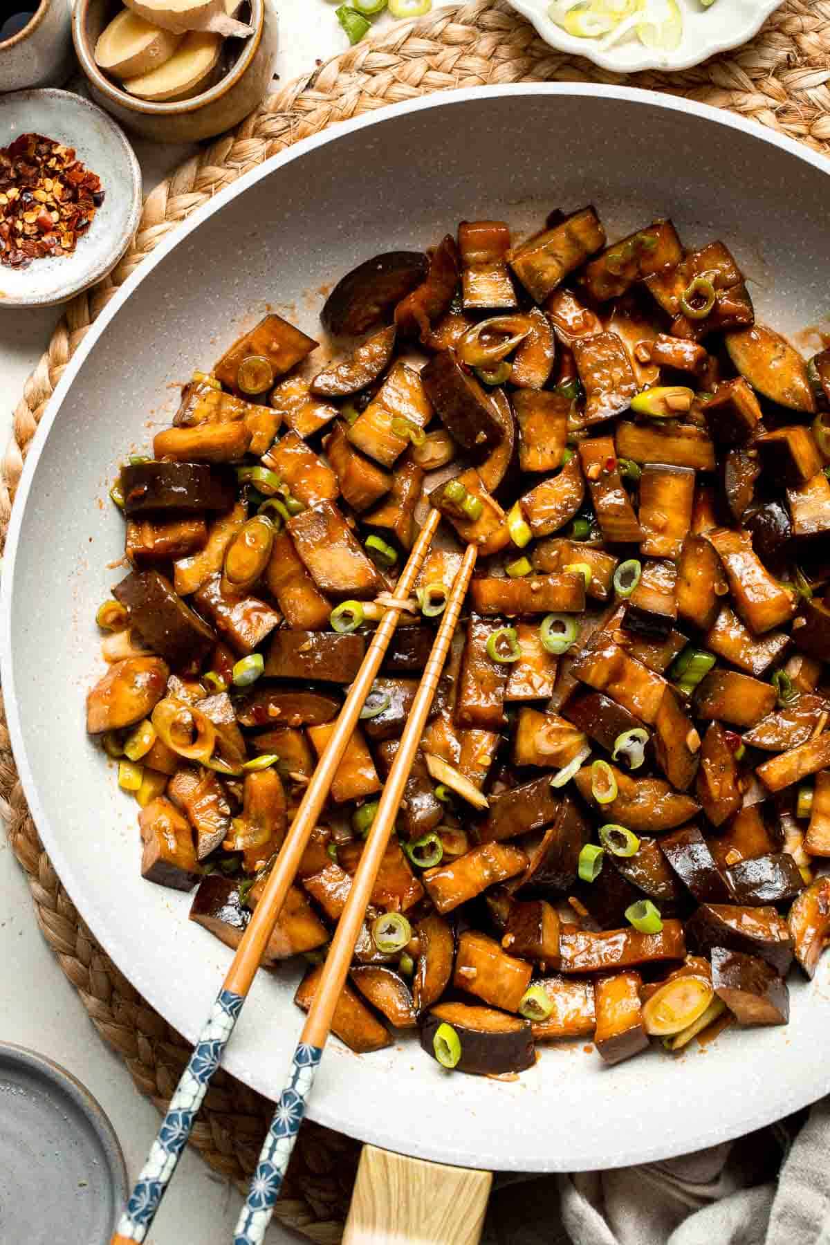 Quick and flavorful, this Chinese Eggplant Stir Fry is packed with garlic, ginger, and savory sauce. Perfect for rice or noodles! | aheadofthyme.com