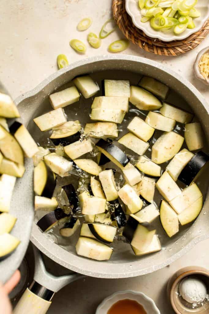 Quick and flavorful, this Chinese Eggplant Stir Fry is packed with garlic, ginger, and savory sauce. Perfect for rice or noodles! | aheadofthyme.com